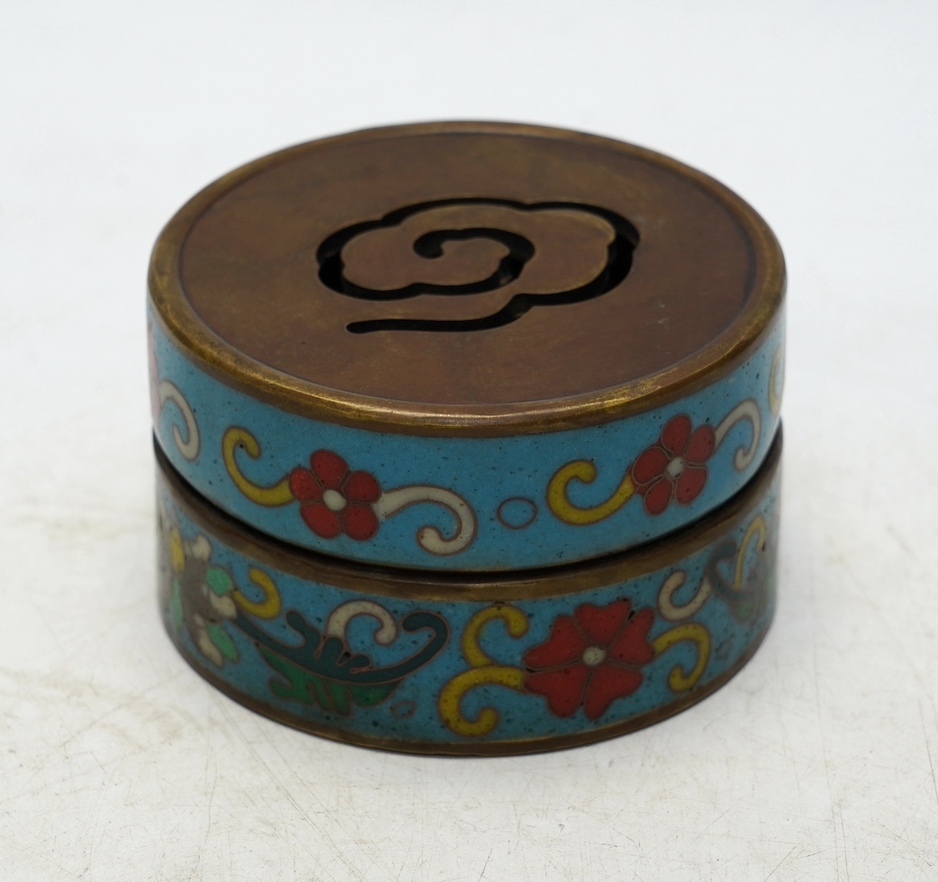 A heavy Chinese cloisonné incense box enamelled with flowers, apocryphal Qianlong mark 8cm in diameter. Condition - fair